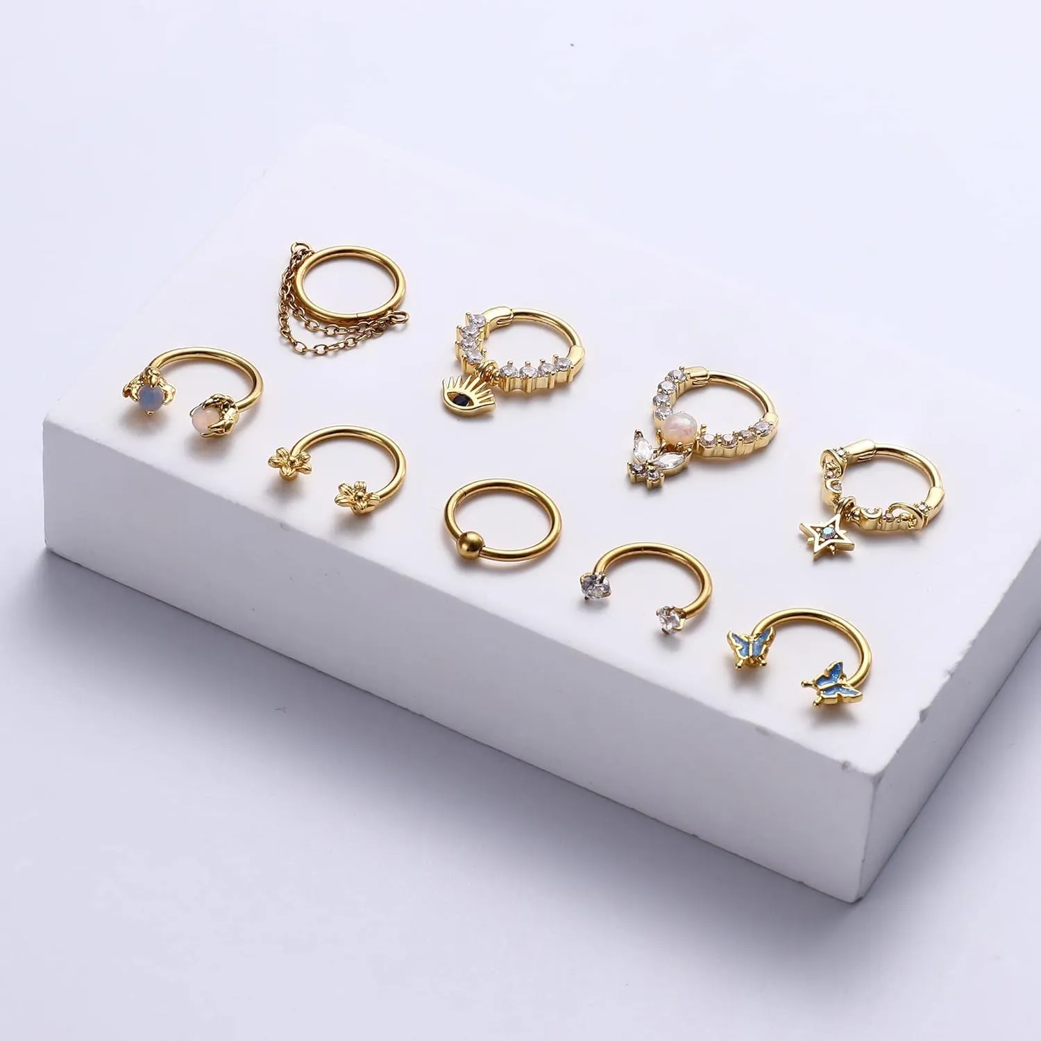 JOERICA 9pc 16G Septum Rings - Small, Dangle & Hoops with Cute, Evil Eye, Butterfly & Flower Designs - Surgical Steel Septum Piercing Jewelry